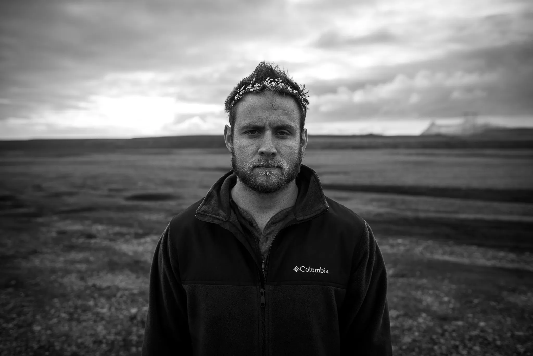 Mark stands on an Iceland beach with his new tiara.